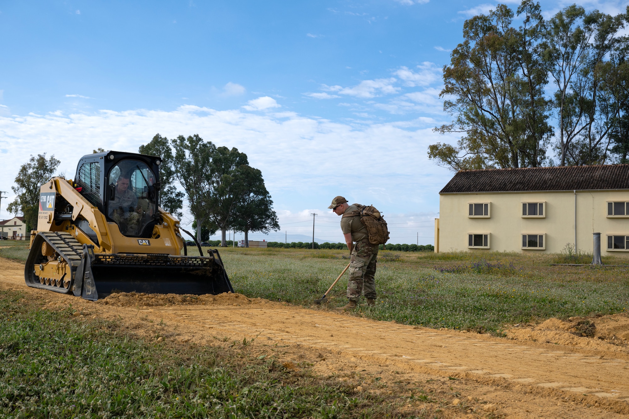 Airmen from the 446th Civil Engineer Squadron fix a natural running path at Moron Air Base, Spain, on May 7, 2025.