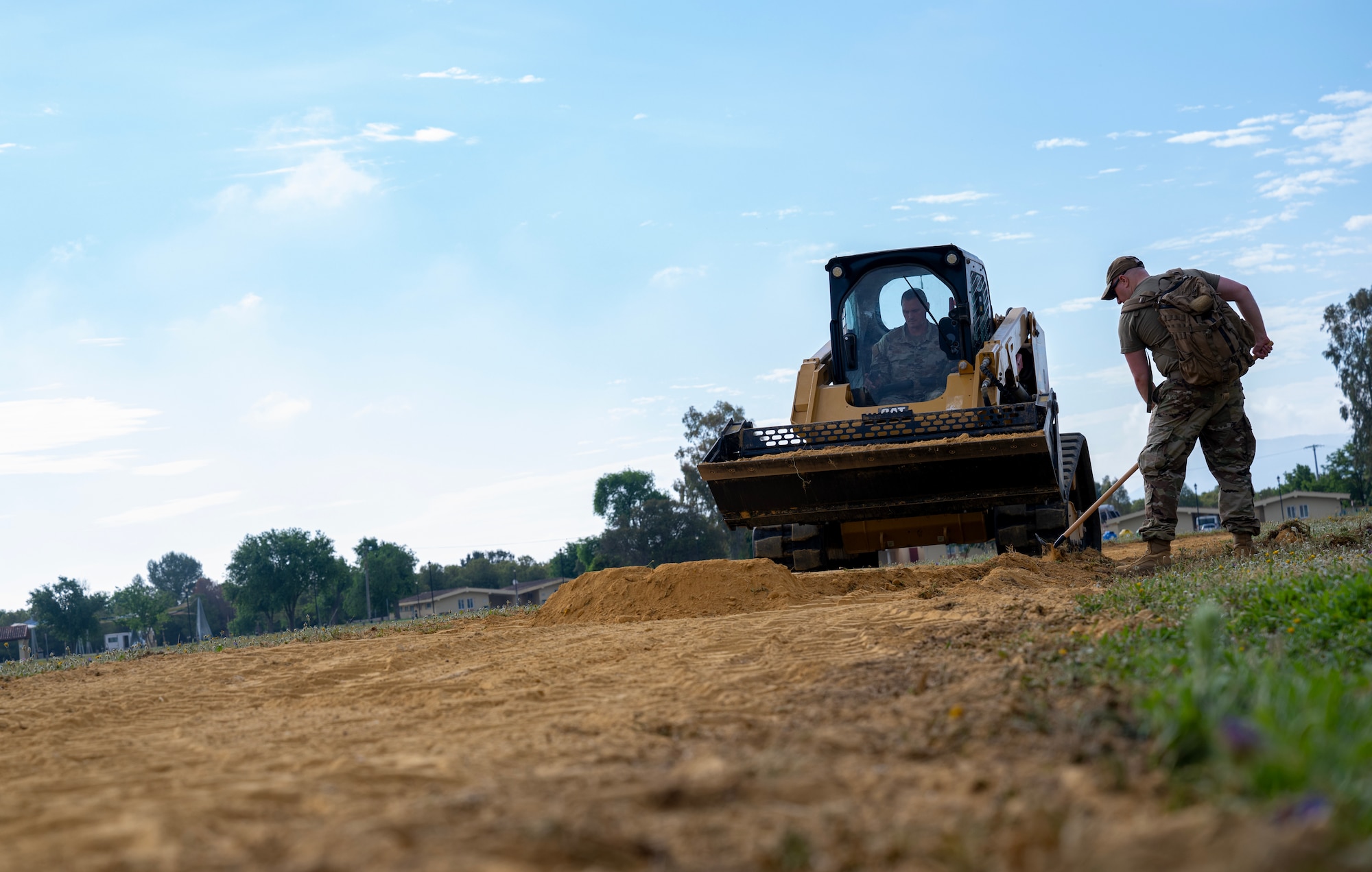 Airmen from the 446th Civil Engineer Squadron fix a natural running path at Moron Air Base, Spain, on May 7, 2025.