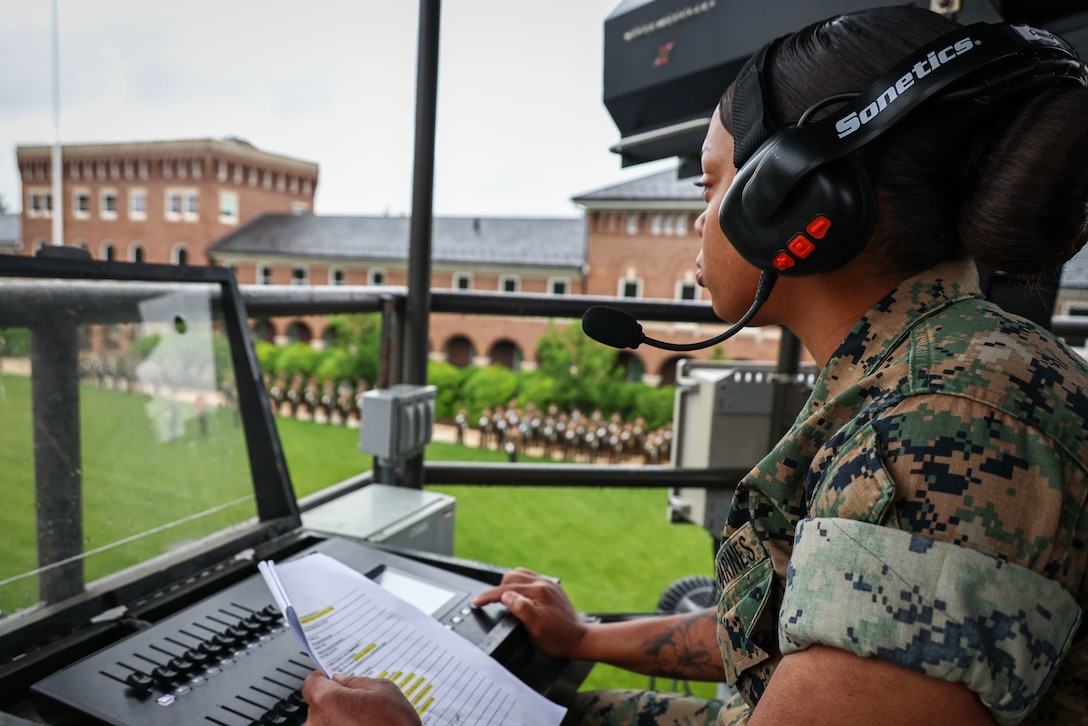 U.S. Marine Corps Lance Cpl. Patricia Garciagonzalez, a maintenance electrician with Headquarters and Service Company, Marine Barracks Washington, works the soundboard during Friday Evening Parade rehearsal at Marine Barracks Washington, D.C., May 9, 2025. Marines with the Maintenance platoon at 8th & I play a vital role during the Friday Evening Parades, operating the lights and sound system that play through out the ceremony. Marine Barracks Washington recognizes a Marine that goes above and beyond in their duties in and out uniform daily. (U.S. Marine Corps photo by Lance Cpl. Christopher Prelle)
