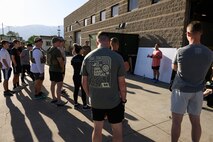Staff Sgt. Jonathan Serrano, 75th Security Forces Squadron, briefs participants of a "Murph" workout at Hill Air Force Base, Utah, May 23, 2025. The "Murph" workout is commonly performed by military units, law enforcement agencies, and individuals around Memorial Day and throughout the year to honor the sacrifices of those who have served.  (U.S. Air Force photo by R. Nial Bradshaw)