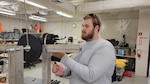 Garrett Flitton, (now) NSWC PCD engineer, tests an attitude sensing system he developed for a tow-fish based sensor package as a Naval Engineering Education Consortium (NEEC) program student at Florida Atlantic University, March 5, 2024. He is one of several FAU students who were hired at NSWC Panama City Division through the NEEC program. (courtesy photo)
