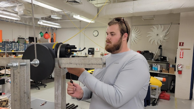 Garrett Flitton, (now) NSWC PCD engineer, tests an attitude sensing system he developed for a tow-fish based sensor package as a Naval Engineering Education Consortium (NEEC) program student at Florida Atlantic University, March 5, 2024. He is one of several FAU students who were hired at NSWC Panama City Division through the NEEC program. (courtesy photo)