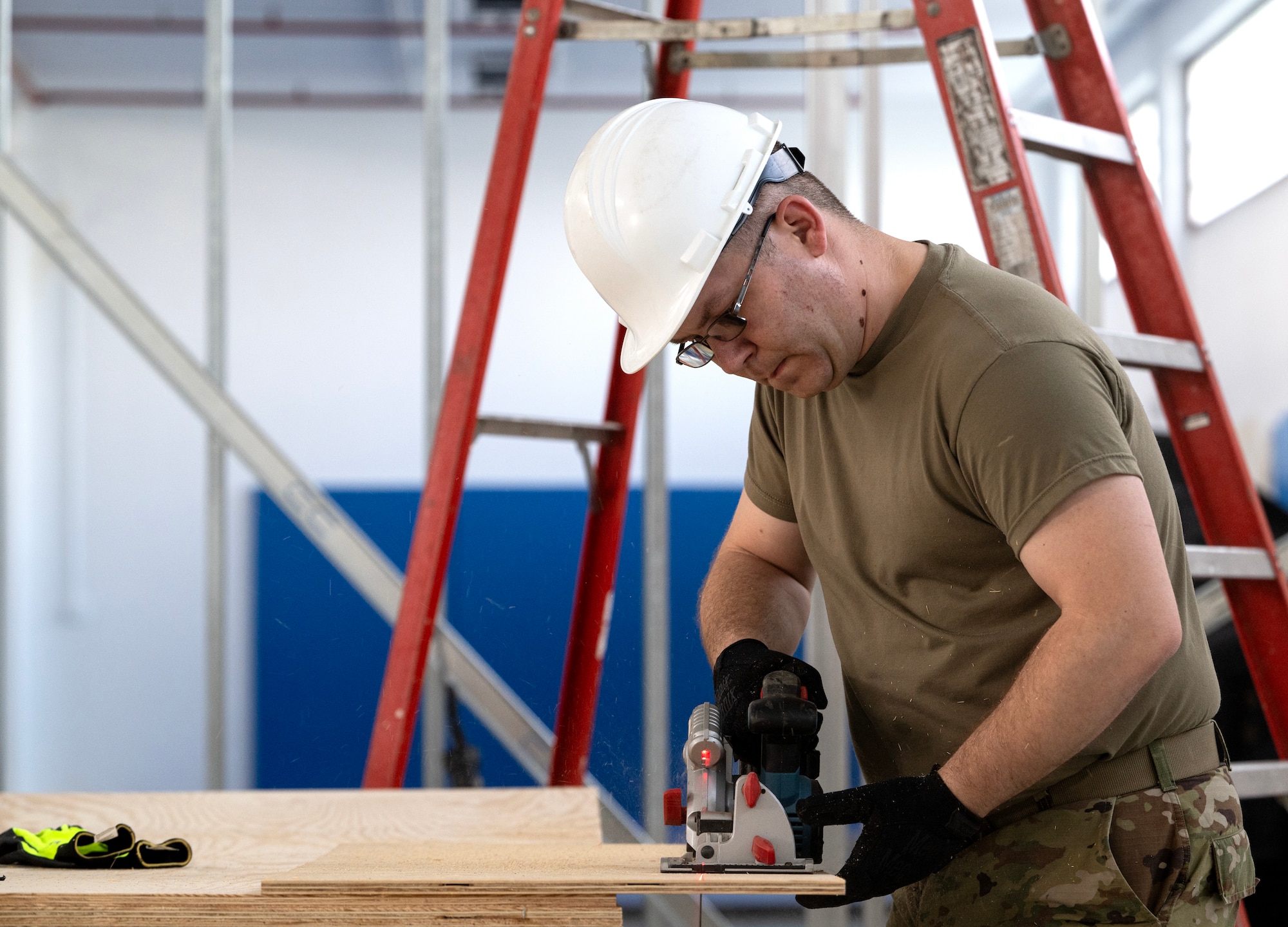 Staff Sgt. Travis Yager, 446th Civil Engineer Squadron HVAC technician, cuts wood panels at Moron Air Base, Spain, on May 8, 2025