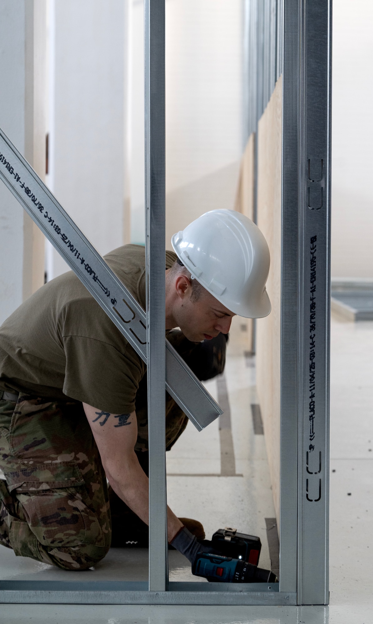 Staff Sgt. Michael Simon, 446th Civil Engineer Squadron HVAC NCOIC, screws framing together at Moron Air Base, Spain, on May 8, 2025.