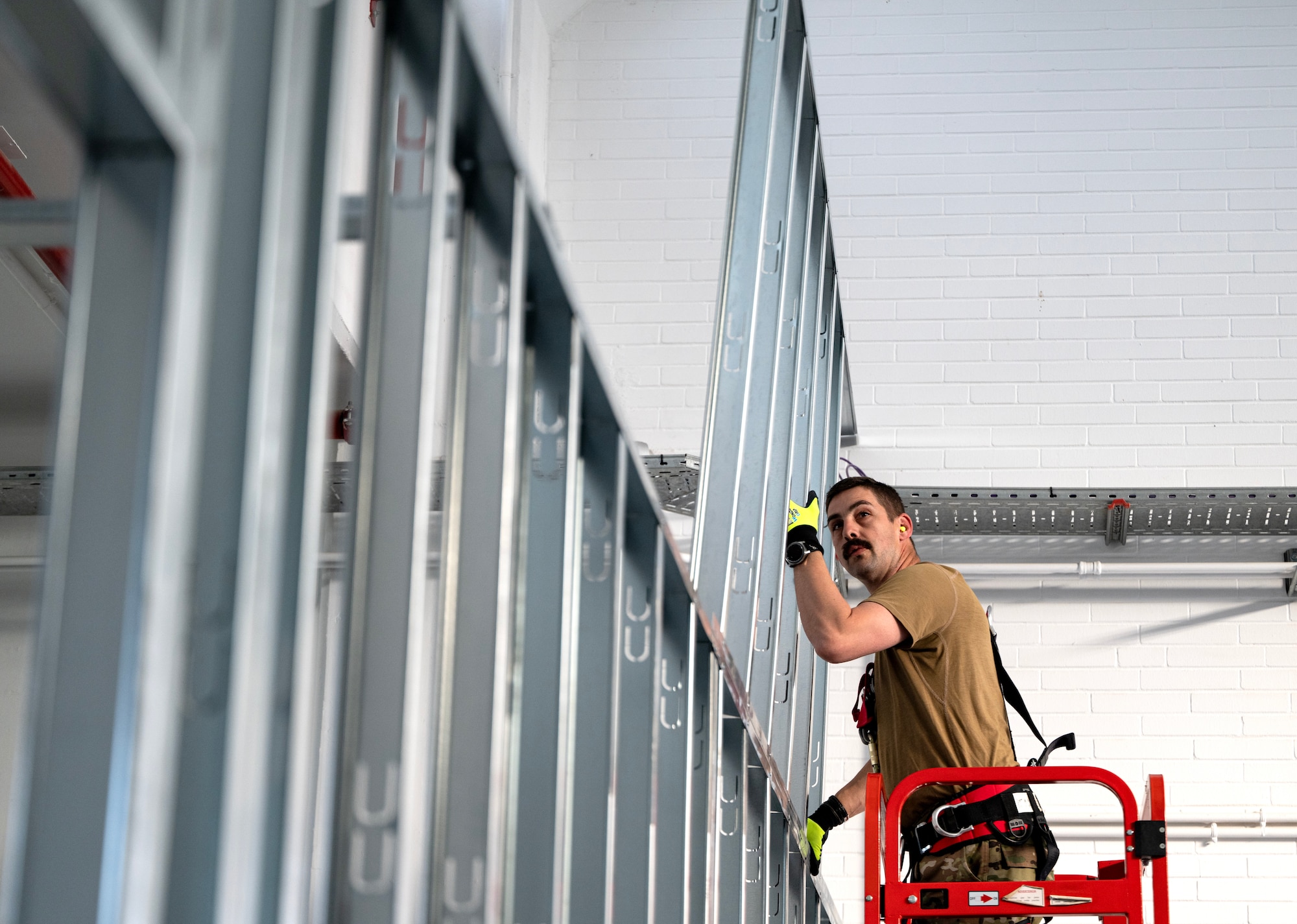 Tech. Sgt. Michael Rizzotti, 446th Civil Engineer Squadron structures NCOIC, puts together a frame for a dark room at Moron Air Base, Spain, on May 8, 2025.