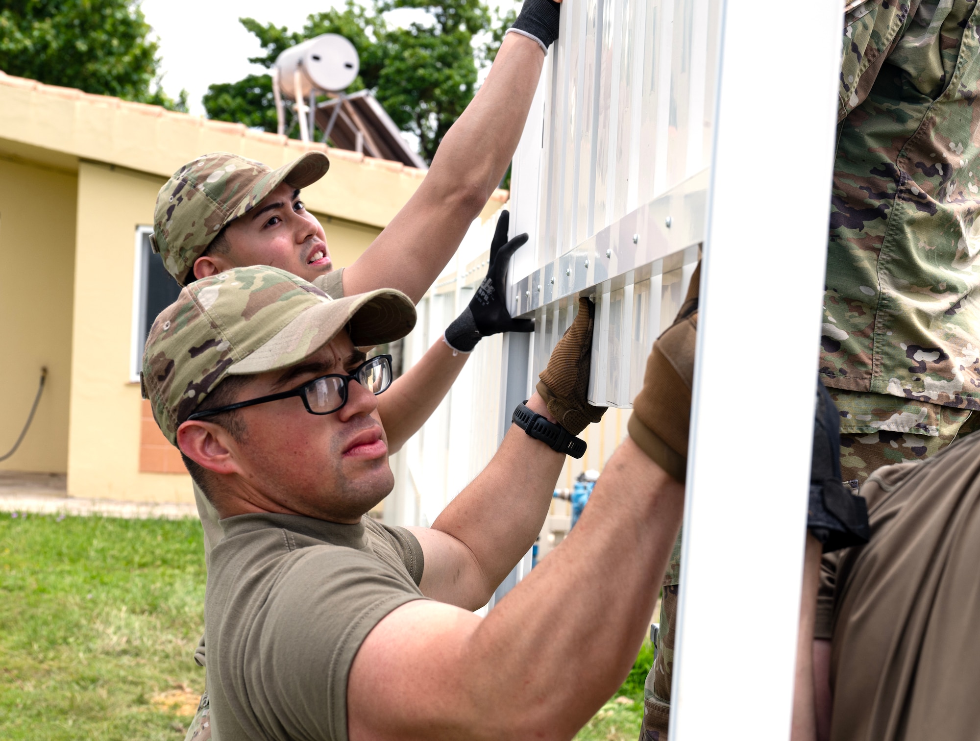 Senior Airmen Eric Mendez, 446th Civil Engineer Squadron  pest management, and LLoyd Lu, 446th CES, put together a fence at Moron Air Base, Spain, on May 8, 2025.