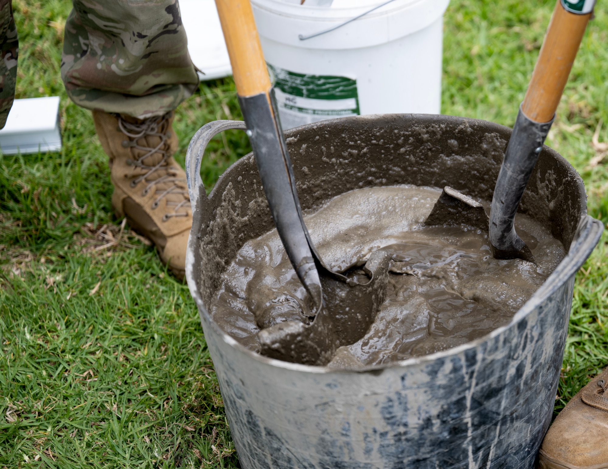 Senior Airmen Eric Mendez, 446th Civil Engineering Squadron pest management, and LLoyd Lu, 446th CES pavement and structures, mix concrete at Moron Air Base, Spain, on May 8, 2025.