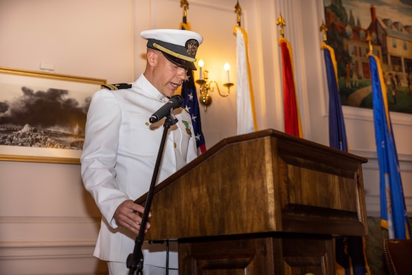 U.S. Navy Sailor Lt. Weston Body, a chaplain with Marine Corps Base Quantico, leads the crowd in prayer during a change of command ceremony at Harry Lee Hall on Marine Corps Base Quantico, Virginia, May 22, 2025. During the ceremony Capt. Grace Key was relieved by Capt. Brookes Williams, the incoming commanding officer of Navy Medicine Readiness and Training Command Quantico. (U.S. Marine Corps Photo by Lance Cpl. Harleigh Faulk)