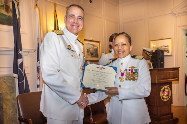 Rear Adm. Kevin Brown, Naval Medical Forces Atlantic commander and Defense Health Network Atlantic directors, left, and Capt. Grace L. Key, outgoing commanding officer of Navy Medicine Readiness and Training Command Quantico, poses for a photo after Key received a Legion of Merit during a change of command ceremony at Harry Lee Hall on Marine Corps Base Quantico, Virginia, May 22, 2025. During the ceremony Key was relieved by Capt. Brookes Williams, incoming commanding officer of Navy Medicine Readiness and Training Command Quantico. (U.S. Marine Corps Photo by Lance Cpl. Harleigh Faulk)