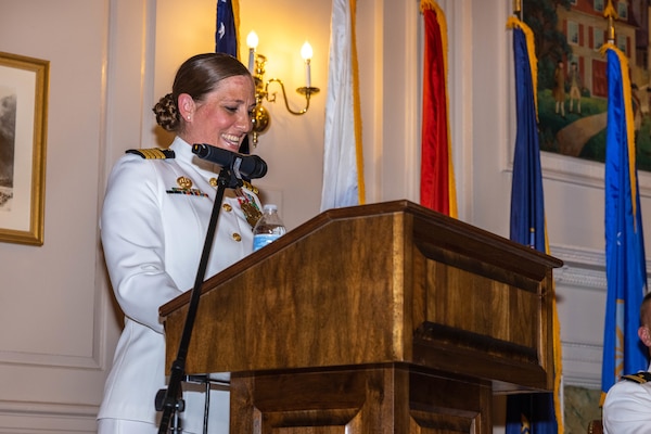 Capt. Brookes Williams, incoming commanding officer of Navy Medicine Readiness and Training Command Quantico, addresses the crowd during a change of command ceremony at Harry Lee Hall on Marine Corps Base Quantico, Virginia, May 22, 2025. During the ceremony Capt. Grace Key, outgoing commanding officer of NMRTCQ, was relieved by Williams. (U.S. Marine Corps Photo by Lance Cpl. Harleigh Faulk)