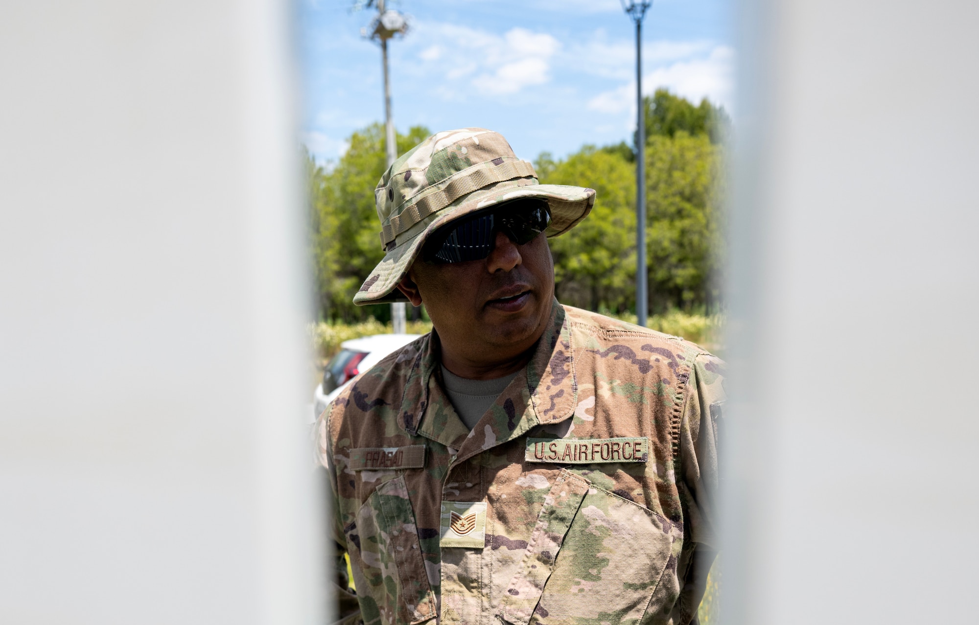 Tech. Sgt. Anuj Prasad, 446th Civil Engineer Squadron power production, inspects a fence at Moron Air Base, Spain on May 12, 2025.