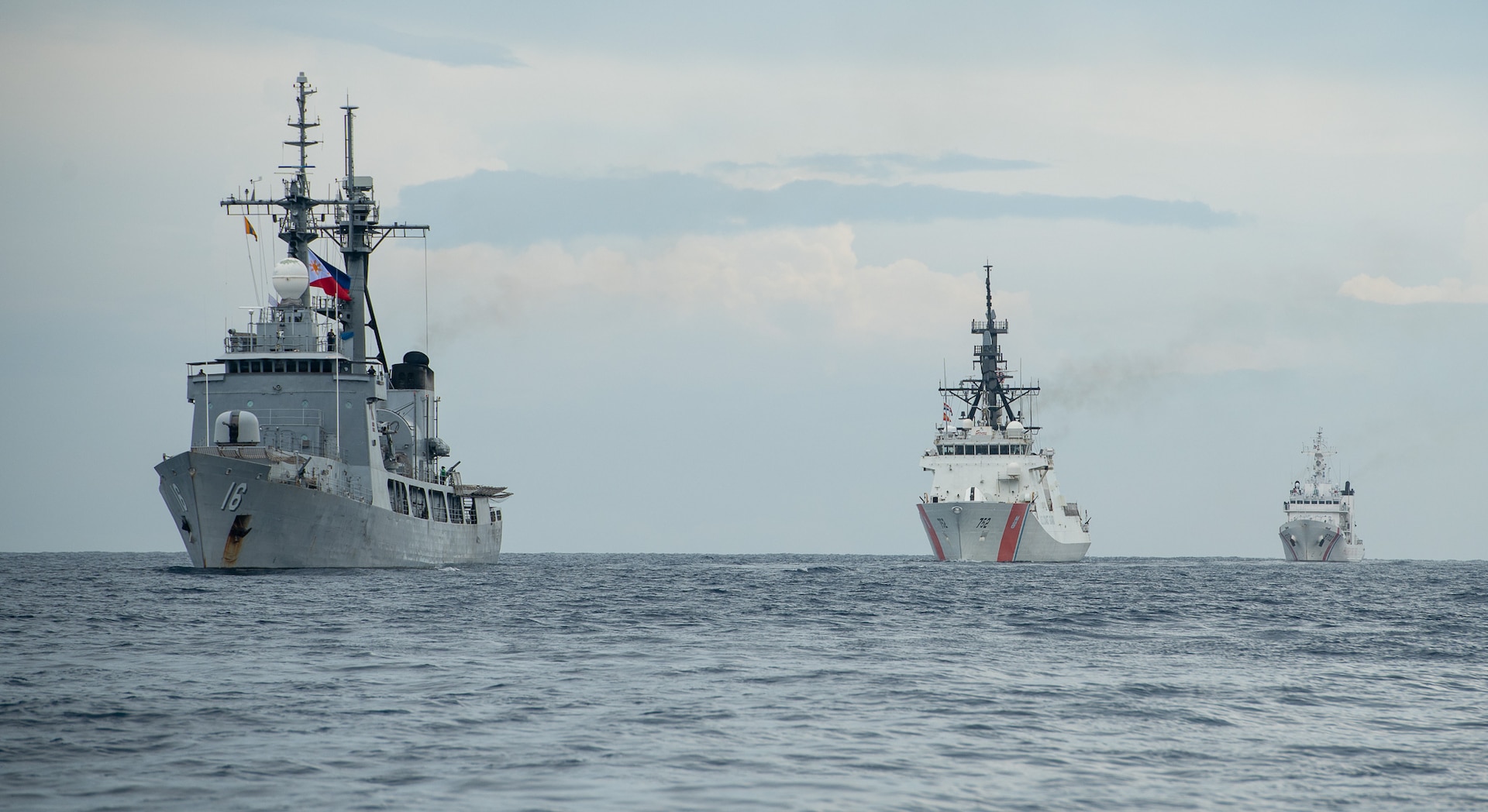 The Legend-class USCGC Stratton (WMSL 752) sails with Philippine Navy’s Gregorio del Pilar-class patrol ship BRP Ramon Alcaraz (PS-16) and Philippine Coast Guard Vessel BRP Melchora Aquino (MRRV-9702) as part of a division tactics exercise in the Sulu Sea, May 20, 2025.  Stratton is deployed and assigned to Destroyer Squadron (DESRON) 15, the Navy’s largest DESRON and the U.S. 7th Fleet’s principal surface force. The U.S. Coast Guard has operated in the Indo-Pacific for more than 150 years, and the service is increasing efforts through targeted bilateral patrols with our national security cutters, fast response cutters, and other activities conducted in support of maritime missions to enhance our regional partnerships. (U.S. Coast Guard photo by Petty Officer 3rd class William Kirk)