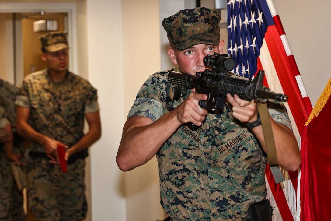 U.S. Marine Corps Pfc. Kaden Truman, a rifleman with Guard Company, Marine Barracks Washington, conducts a practice sweep during emergency response training at Marine Barracks Washington, D.C., April 30, 2025. Marines with Guard Company conduct simulated training to enhance readiness during all ceremonies and parades held at the 8th & I. The drills ensure Marines can respond quickly and effectively to potential threats or emergencies while maintaining ceremonial excellence.