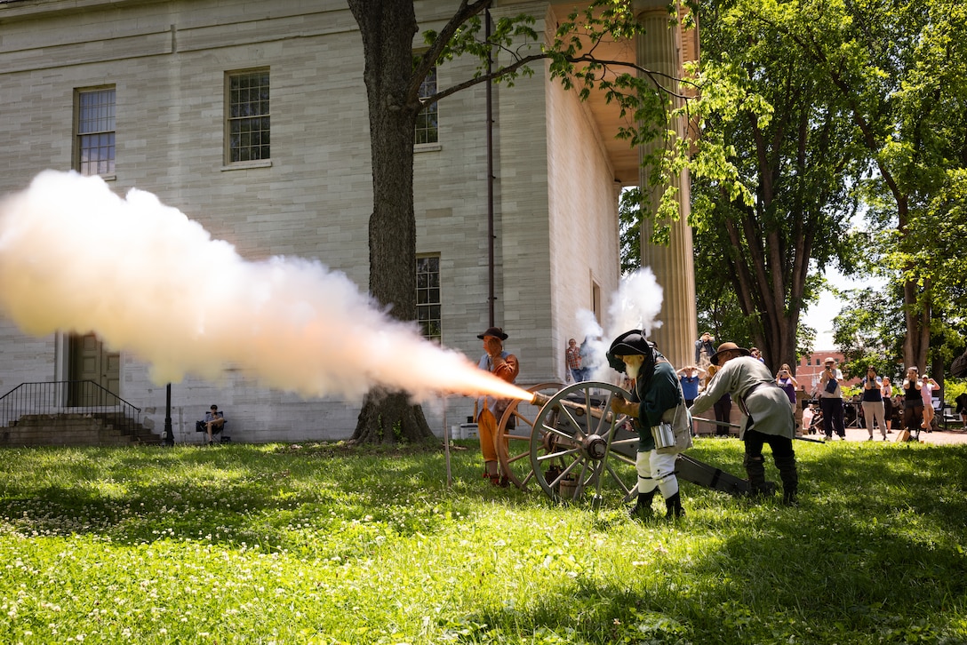 Reenactors with the Painted Stones Settlers fires a cannon at the Kentucky Historical Society’s (KHS) 200th anniversary event at the Old State Capitol in Frankfort, Ky. on May 17, 2025. The Kentucky National Guard’s 202nd Army Band supported the 200th anniversary of the French officer Marquis de Lafayette’s visit of Frankfort which was coordinated by the KHS. (U.S. Army National Guard photo by Sgt. 1st Class Andrew Dickson)