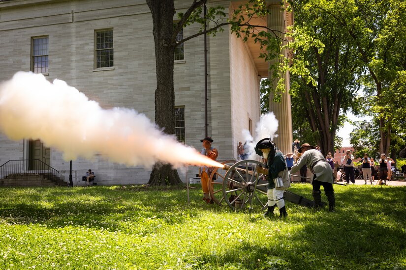 Reenactors with the Painted Stones Settlers fires a cannon at the Kentucky Historical Society’s (KHS) 200th anniversary event at the Old State Capitol in Frankfort, Ky. on May 17, 2025. The Kentucky National Guard’s 202nd Army Band supported the 200th anniversary of the French officer Marquis de Lafayette’s visit of Frankfort which was coordinated by the KHS. (U.S. Army National Guard photo by Sgt. 1st Class Andrew Dickson)