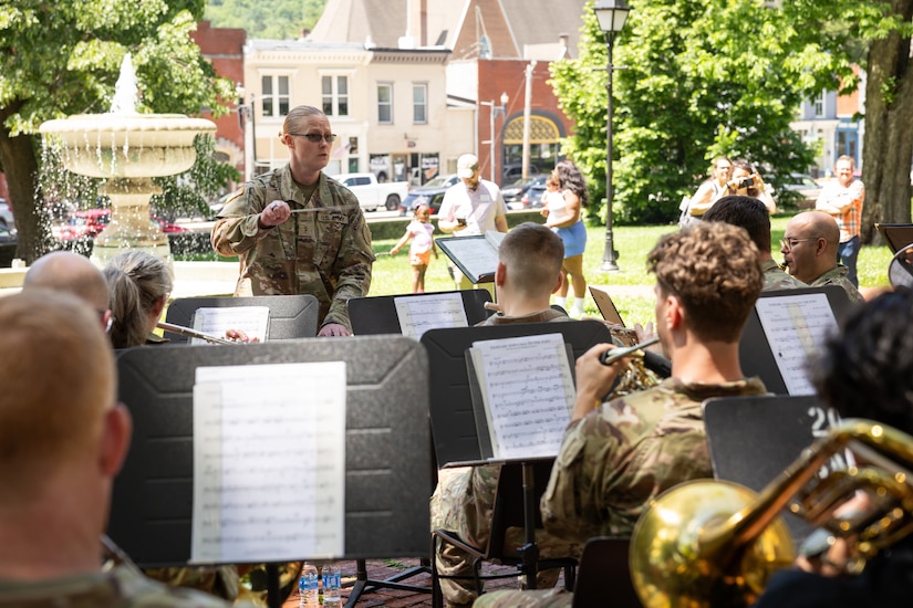 U.S. Army Chief Warrant Officer 2 Catherine Strobel, commander of the Kentucky National Guard’s 202nd Army Band, conducts the concert at the Kentucky Historical Society’s (KHS) 200th anniversary event at the Old State Capitol in Frankfort, Ky. on May 17, 2025. The band supported the 200th anniversary of the French officer Marquis de Lafayette’s visit of Frankfort which was coordinated by the KHS. (U.S. Army National Guard photo by Sgt. 1st Class Andrew Dickson)