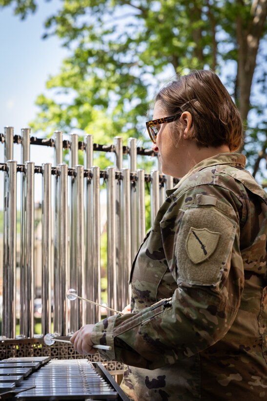 U.S. Army Sgt. Brittny Kempfer, a percussionist for the Kentucky National Guard’s 202nd Army Band, plays the bells at a concert at the Kentucky Historical Society’s (KHS) 200th anniversary event at the Old State Capitol in Frankfort, Ky. on May 17, 2025. The band supported the 200th anniversary of the French officer Marquis de Lafayette’s visit of Frankfort which was coordinated by the KHS. (U.S. Army National Guard photo by Sgt. 1st Class Andrew Dickson)