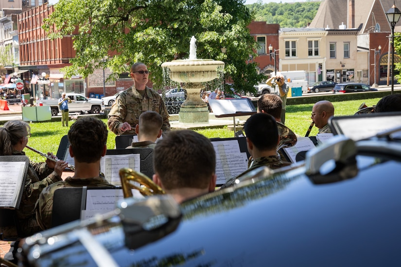 U.S. Army Chief Warrant Officer 2 Catherine Strobel, commander of the Kentucky National Guard’s 202nd Army Band, conducts the concert at the Kentucky Historical Society’s (KHS) 200th anniversary event at the Old State Capitol in Frankfort, Ky. on May 17, 2025. The band supported the 200th anniversary of the French officer Marquis de Lafayette’s visit of Frankfort which was coordinated by the KHS. (U.S. Army National Guard photo by Sgt. 1st Class Andrew Dickson)