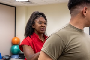 Kimberly Coffee, an athletic trainer for the 1st Sustainment Brigade, helps Soldiers recover from injury on Fort Riley, KS, on March 27, 2025. Soldiers are able to utilize programs such as Holistic Health and Fitness as a means of quick recovery when they are unable to be seen by heath care providers at the clinic. (U.S. Army photo by Spc. Autumn Johnson)