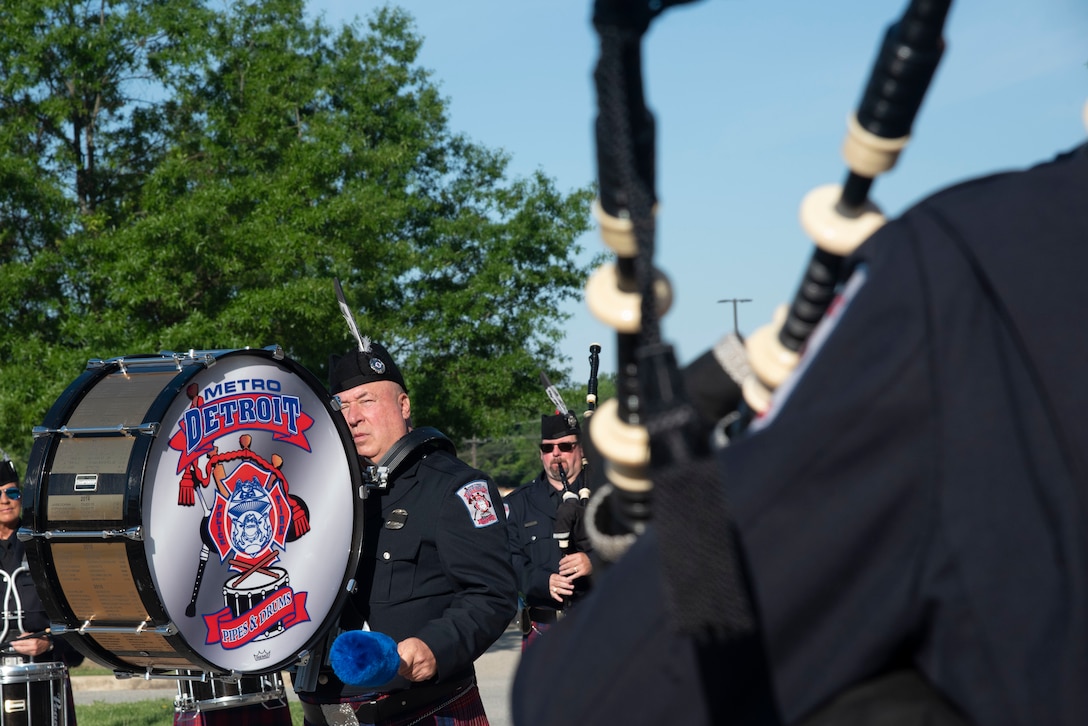 Members of the Metro Detroit Police and Fire Pipes and Drums ceremonial band plays the U.S. Air Force song at the conclusion of the opening ceremony for National Police Week at Joint Base Andrews, Md., May 12, 2025. The group traveled to the National Capital Region to perform in Police Week ceremonies and observances. (U.S. Air Force photo by Patrick Griffith)
