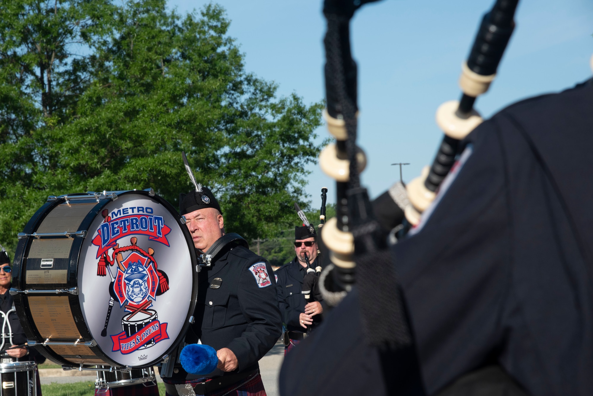 Members of the Metro Detroit Police and Fire Pipes and Drums ceremonial band plays the U.S. Air Force song at the conclusion of the opening ceremony for National Police Week at Joint Base Andrews, Md., May 12, 2025. The group traveled to the National Capital Region to perform in Police Week ceremonies and observances. (U.S. Air Force photo by Patrick Griffith)