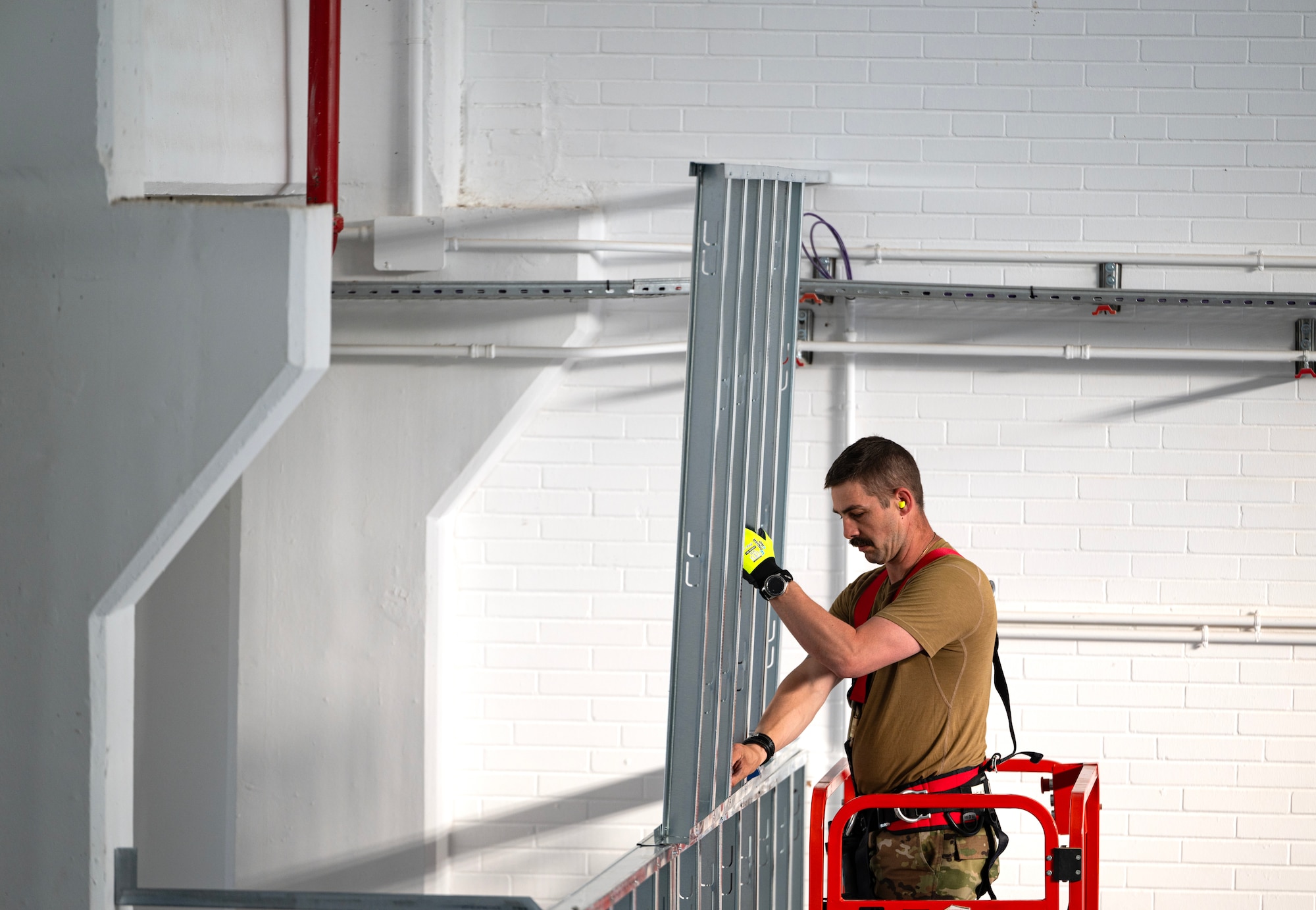 Tech. Sgt. Michael Rizzotti, 446th Civil Engineer Squadron structures NCOIC, puts together a frame for a dark room at Moron Air Base, Spain, on May 8, 2025.