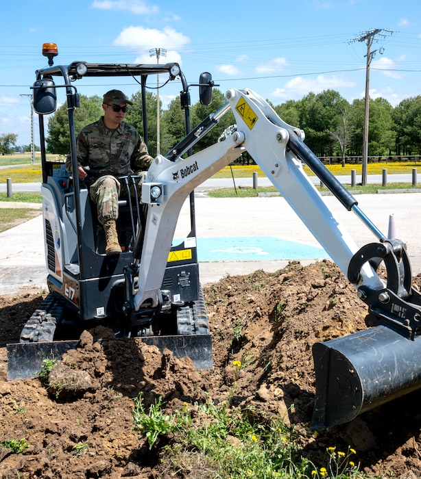 Senior Airman Kyu Wintersteen, 446th Civil Engineer Squadron pavement and construction equipment journeyman, moves dirt to lay groundwork for a ramp at Moron Air Base, Spain, on May 6, 2025.