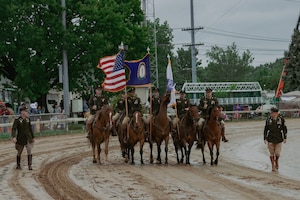 1st Infantry Division's Commanding General's Mounted Color Guard (1IDCGMCG) attends the Kentucky Derby to perform the Passing of the Colors, on May 3, 2025. This is the first year that U.S. Army horses have been invited to perform on track grounds since the Derby’s beginnings in 1875. (U.S. Army photo by Sgt. Tyler Selige)