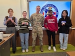 LTC Michael Antonas of the Ohio Army National Guard presented a challenge coin Feb. 26 to four Hacking for Defense students at Carnegie Mellon University in Pittsburgh for their work on a project to help recruiting efforts.