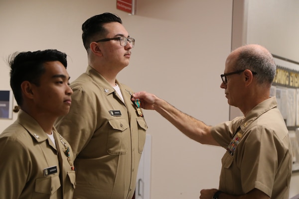 On May 9, Capt. Aaron D. Werbel, commanding officer of Navy Medicine Readiness and Training Command Lemoore awarded Hospital Corpsman Third (HM3) Class Dominic T. Morgan and HM3 Gerwin Riel M. Quemquem with on-the-spot U.S. Navy and Marine Corps Achievement Medals (NAM), also known as a ‘Spot NAM’.  This award highlights a specific achievement or impact shortly after the event occurred. (DoD Photo by Elaine Heirigs/released)