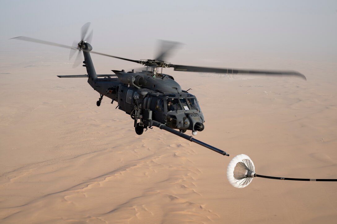 HH-60 flying over desert