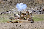 Marines assigned to Marine Forces Special Operations Command and an Air Force pararescueman fire a M224A1 mortar system during a training event at Camp Guernsey Joint Training Center, Wyo., April 9, 2025. The training center offers a diverse range of resources for military readiness, including extensive live-fire ranges, urban combat training sites, convoy operations courses and rugged terrain ideal for realistic field exercises.