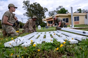 Airmen from the 446th Civil Engineer Squadron put together a fence gate at Moron Air Base, Spain, on May 8, 2025.
