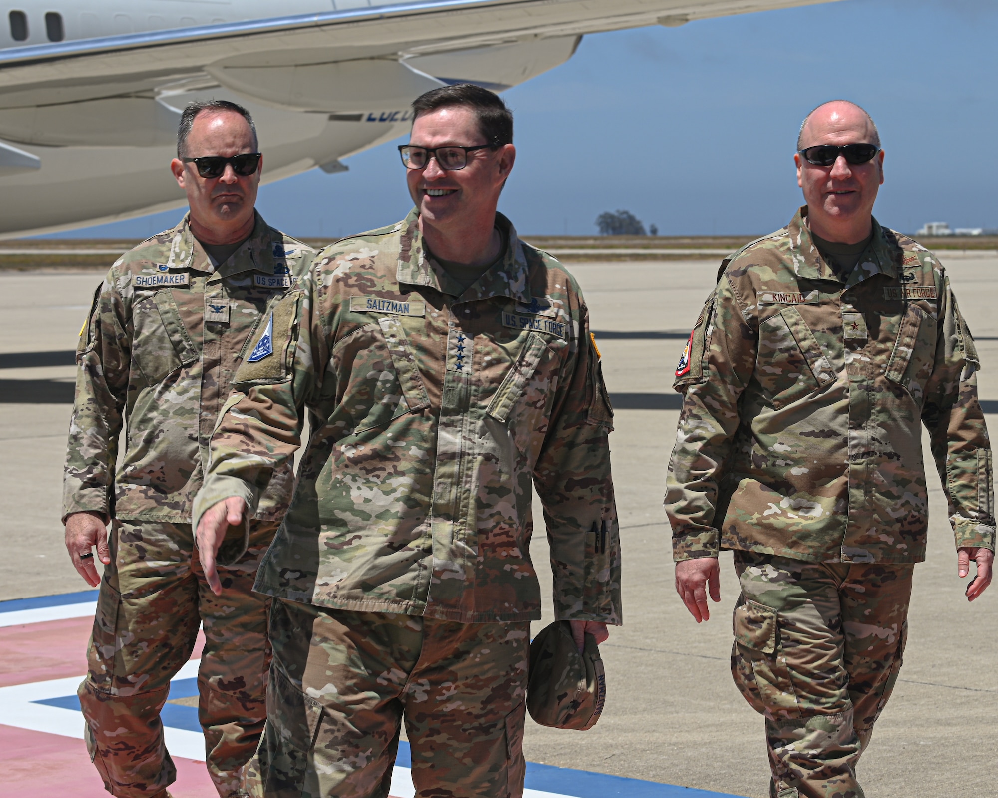 U.S. Space Force Chief of Space Operations Gen. Chance Saltzman, center, is greeted by Brig. Gen. Frank Kincaid, Space Forces - Space deputy commander, right, and Col. Mark Shoemaker, Space Launch Delta 30 commander, left, as he disembarks from an aircraft during a visit to Vandenberg Space Force Base.