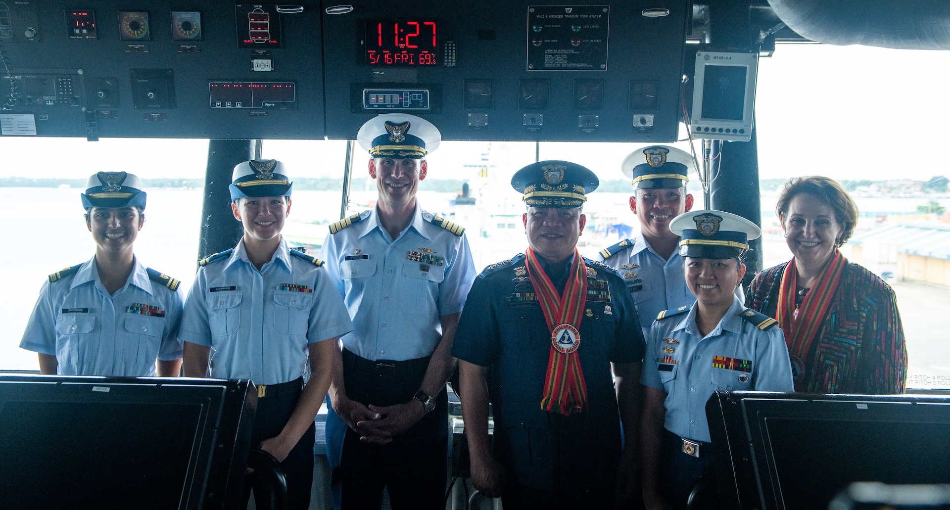 Lt. j.g. Sonia Sriniwass, Lt. j.g. Kata Cummings, Capt. Brian Krautler, Adm. Ronnie Gil Gavan, lt. j.g. Rojas, Lt. j.g. Antonio, and Ambassador MaryKay Carlson pose for a photo on the bridge of the Legend-class USCGC Stratton (WMSL 752) during a cutter familiarization tour in Puerto Princesa, Philippines, May 16, 2025. Stratton is deployed and assigned to Destroyer Squadron (DESRON) 15, the Navy’s largest DESRON and the U.S. 7th Fleet’s principal surface force. U.S. Coast Guard Cutter Stratton is deployed to the Indo-Pacific to advance relationships with ally and partner nations to build a more secure and prosperous region with unrestricted, lawful access to maritime commons. (U.S. Coast Guard photo by Petty Officer 3rd Class William Kirk)
