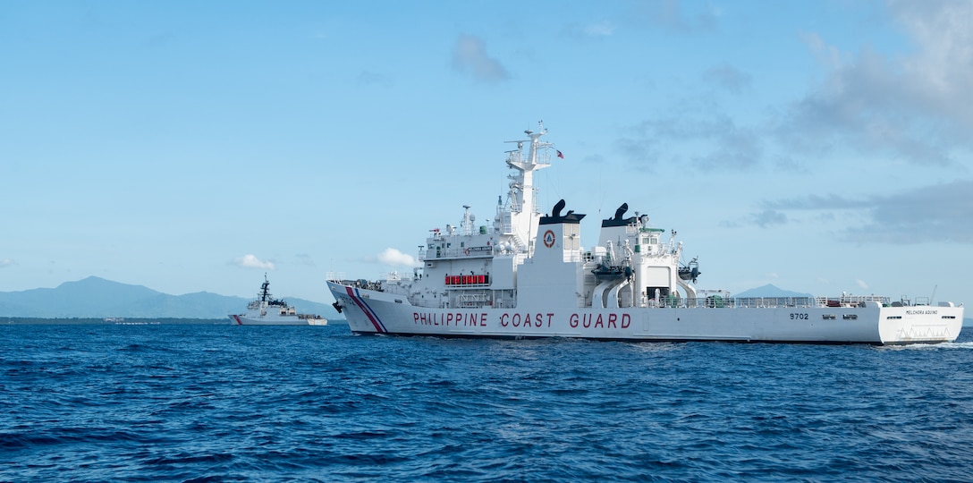 The Legend-class USCGC Stratton (WMSL 752) sails alongside a Philippine Coast Guard vessel as Stratton arrives in Puerto Princesa, Philippines, May 16, 2025. Stratton is deployed and assigned to Destroyer Squadron (DESRON) 15, the Navy’s largest DESRON and the U.S. 7th Fleet’s principal surface force. U.S. Coast Guard Cutter Stratton is deployed to the Indo-Pacific to advance relationships with ally and partner nations to build a more secure and prosperous region with unrestricted, lawful access to maritime commons. (U.S. Coast Guard photo by Petty Officer 3rd Class William Kirk)
