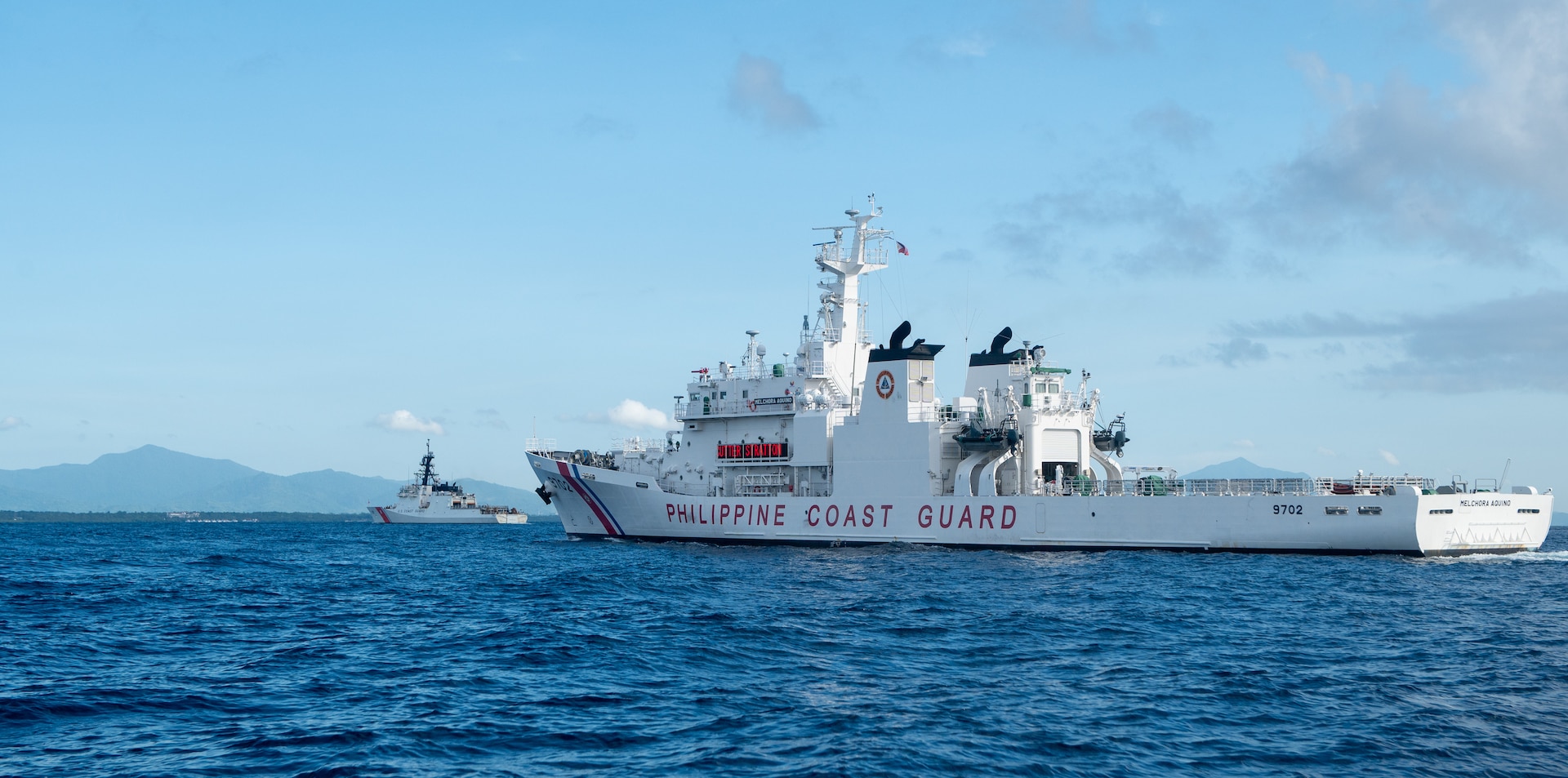 The Legend-class USCGC Stratton (WMSL 752) sails alongside a Philippine Coast Guard vessel as Stratton arrives in Puerto Princesa, Philippines, May 16, 2025. Stratton is deployed and assigned to Destroyer Squadron (DESRON) 15, the Navy’s largest DESRON and the U.S. 7th Fleet’s principal surface force. U.S. Coast Guard Cutter Stratton is deployed to the Indo-Pacific to advance relationships with ally and partner nations to build a more secure and prosperous region with unrestricted, lawful access to maritime commons. (U.S. Coast Guard photo by Petty Officer 3rd Class William Kirk)