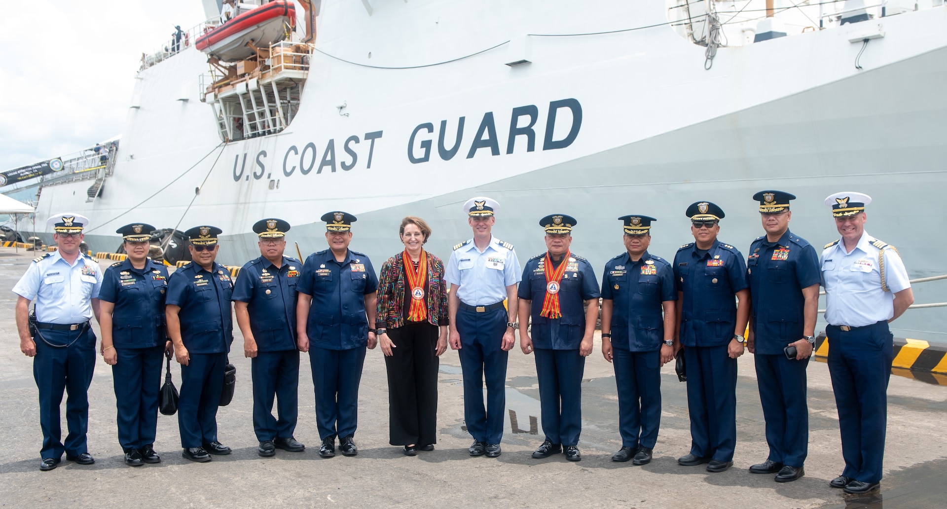 Command members of the Legend-class USCGC Stratton (WMSL 752), Ambassador MaryKay Carlson, Philippine Coast Guard Adm. Ronnie Gil Gavan, and members of the Philippines Coast Guard pose outside the Stratton in Puerto Princesa, Philippines, May 16, 2025. Stratton is deployed and assigned to Destroyer Squadron (DESRON) 15, the Navy’s largest DESRON and the U.S. 7th Fleet’s principal surface force. U.S. Coast Guard Cutter Stratton is deployed to the Indo-Pacific to advance relationships with ally and partner nations to build a more secure and prosperous region with unrestricted, lawful access to maritime commons. (U.S. Coast Guard photo by Petty Officer 3rd Class William Kirk)