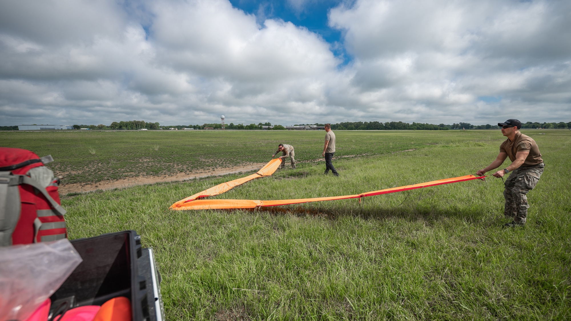 Airmen from the Kentucky Air National Guard set up a landing zone marker for five combat controllers to parachute into Barkley Regional Airport in Paducah, Ky., May 13, 2025, from a C-130J Super Hercules aircraft. The insertion is part of Exercise Grindstone, a three-day earthquake-response scenario staged in the New Madrid Seismic Zone, the most active seismic area in the Eastern United States. (U.S. Air National Guard photo by Dale Greer)