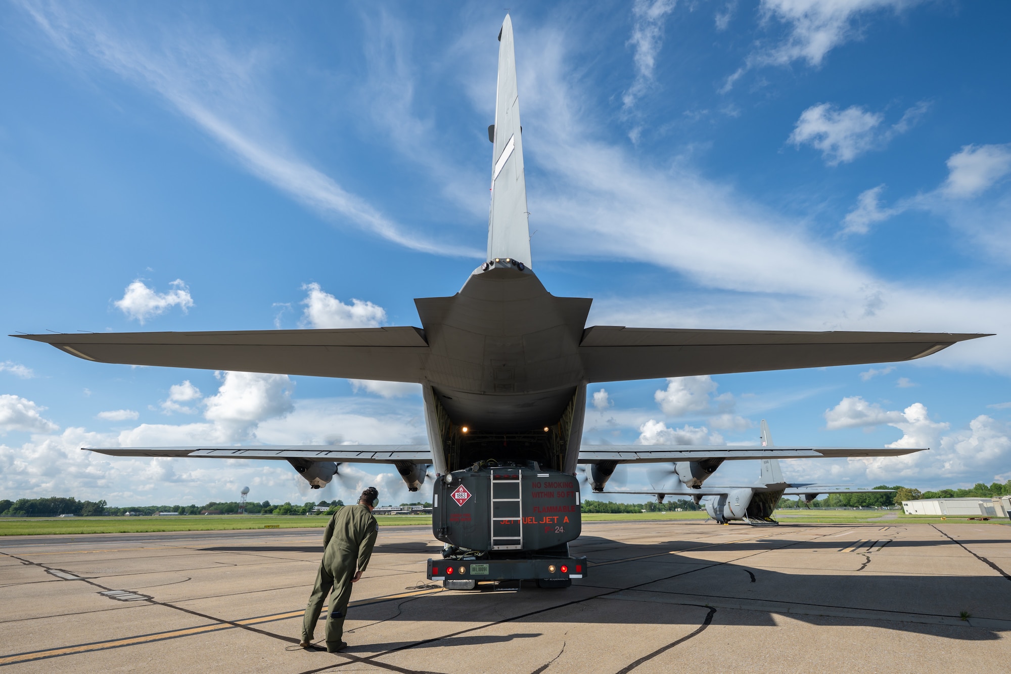 A loadmaster from the Kentucky Air National Guard’s 165th Airlift Squadron, directs the offloading of an R-11 refueling truck from a C-130J Super Hercules aircraft at Barkley Regional Airport in Paducah, Ky., May 13, 2025, in support of Exercise Grindstone, a three-day earthquake-response scenario staged in the New Madrid Seismic Zone. Paducah lies within the zone, the most active seismic area in the Eastern United States, and could serve as an air hub in the event of an large-scale earthquake  (U.S. Air National Guard photo by Dale Greer)
