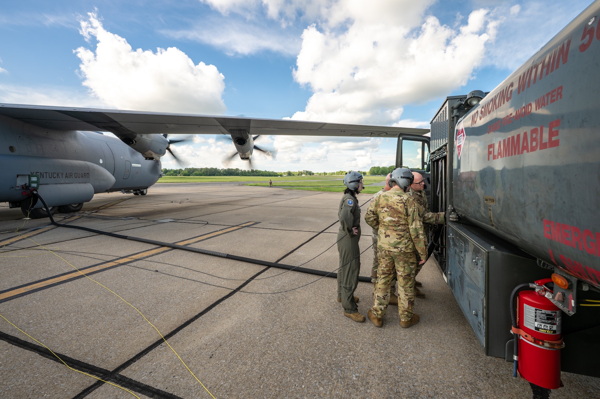 Airmen from the Kentucky Air National Guard’s 123rd Contingency Response Group and 165th Airlift Squadron offload aviation fuel from a C-130J Super Hercules Aircraft to an R-11 refueling truck in support of a major earthquake-response exercise at Barkley Regional Airport in Paducah, Ky., May 13, 2025. The specialized fueling operation, which can be conducted even while aircraft engines are running, is a logistics multiplier that enables C-130s to quickly supply fuel for use by helicopters at remote airfields, which might otherwise lack electrical power or the necessary infrastructure following an earthquake. (U.S. Air National Guard photo by Dale Greer)