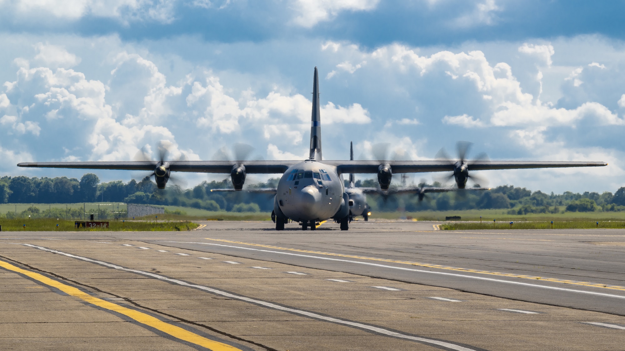 Two C-130J Super Hercules aircraft from the Kentucky Air National Guard’s 165th Airlift Squadron taxi into Barkley Regional Airport in Paducah, Ky., May 13, 2025, carrying Airmen and equipment needed to stand up an aerial port that will function as a cargo hub and evacuation center as part of Exercise Grindstone, a major earthquake-response simulation. Paducah lies within the New Madrid Seismic Zone, the most active seismic area in the Eastern United States, and could serve as an air hub in the event of an large-scale earthquake  (U.S. Air National Guard photo by Dale Greer)