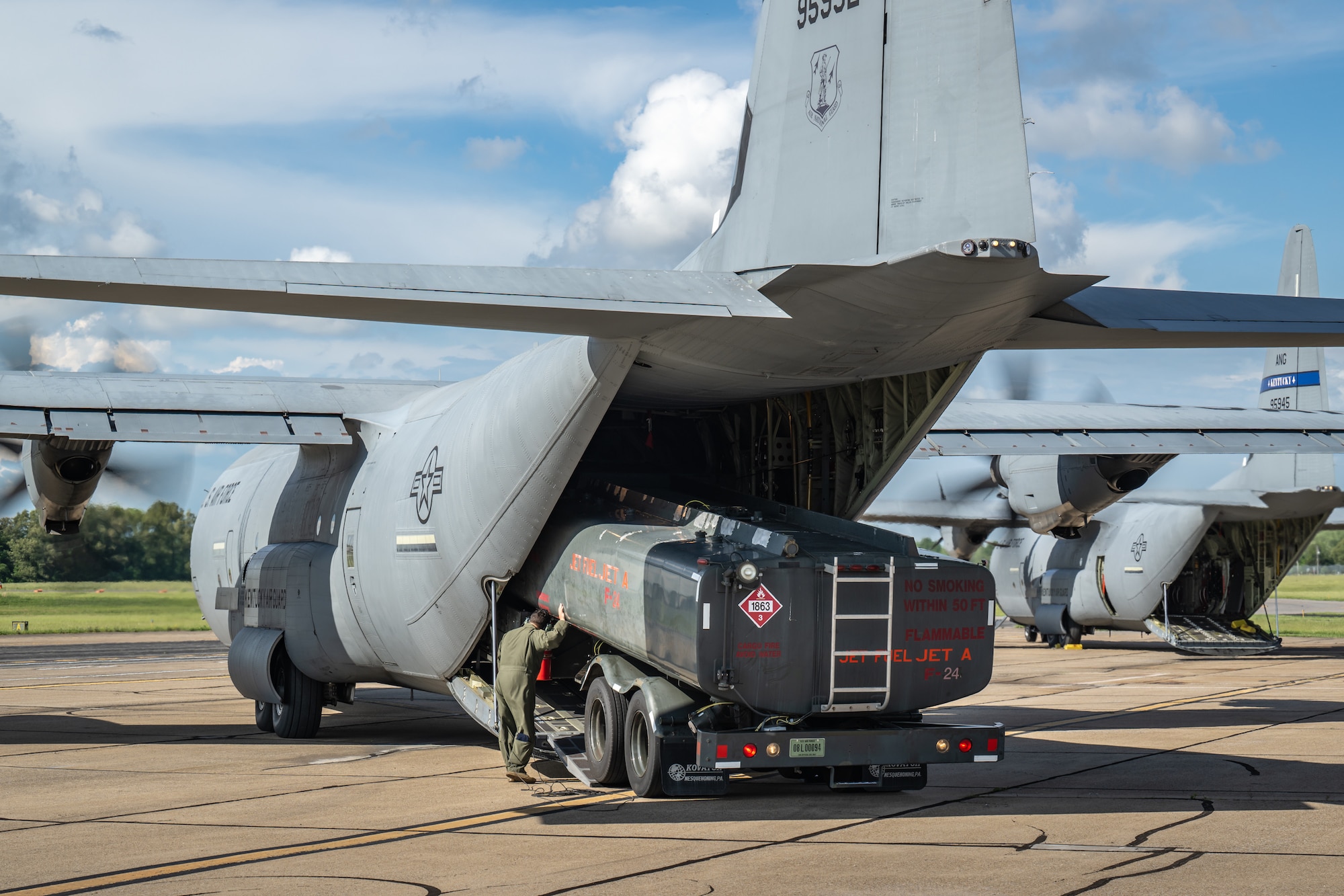 A loadmaster from the Kentucky Air National Guard’s 165th Airlift Squadron, directs the offloading of an R-11 refueling truck from a C-130J Super Hercules aircraft at Barkley Regional Airport in Paducah, Ky., May 13, 2025, in support of Exercise Grindstone, a three-day earthquake-response scenario staged in the New Madrid Seismic Zone. Paducah lies within the zone, the most active seismic area in the Eastern United States, and could serve as an air hub in the event of an large-scale earthquake  (U.S. Air National Guard photo by Dale Greer)