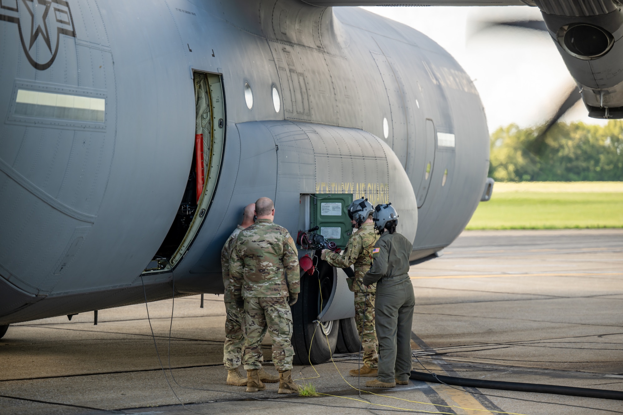 Airmen from the Kentucky Air National Guard’s 123rd Contingency Response Group and 165th Airlift Squadron offload aviation fuel from a C-130J Super Hercules Aircraft to an R-11 refueling truck in support of a major earthquake-response exercise at Barkley Regional Airport in Paducah, Ky., May 13, 2025. The specialized fueling operation, which can be conducted even while aircraft engines are running, is a logistics multiplier that enables C-130s to quickly supply fuel for use by helicopters at remote airfields, which might otherwise lack electrical power or the necessary infrastructure following an earthquake. (U.S. Air National Guard photo by Dale Greer)