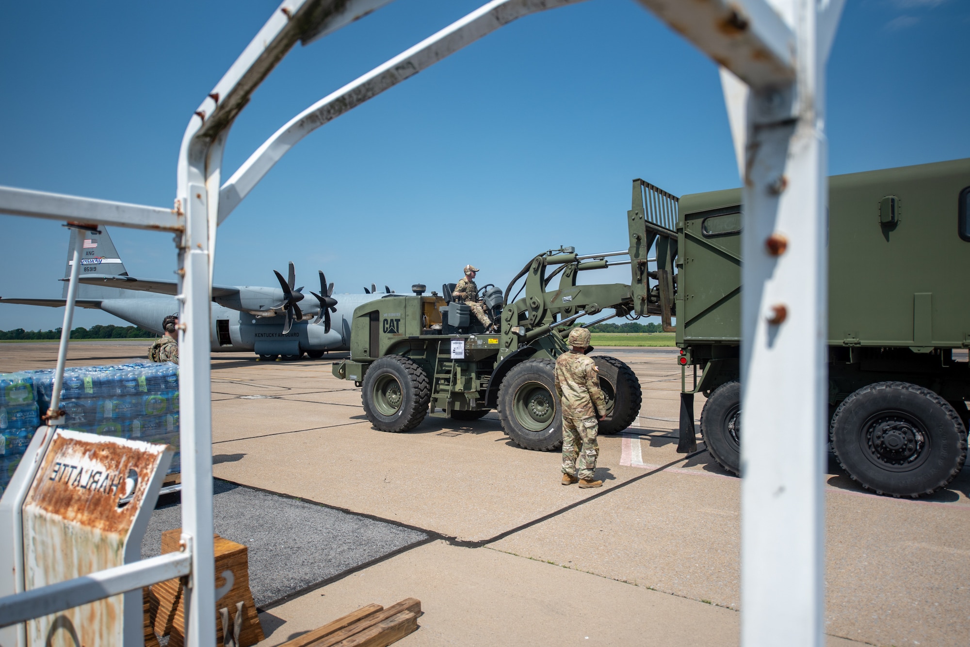 Members of the Kentucky National Guard load pallets of water onto a truck at Barkley Regional Airport in Paducah, Ky., May 14, 2025, in support of Exercise Grindstone, a major earthquake-response simulation. The Kentucky Army National Guard’s 1792nd Combat Sustainment Support Battalion drove the water to nearby counties for humanitarian relief efforts as part of the earthquake scenario. (U.S. Air National Guard photo by Phil Speck)