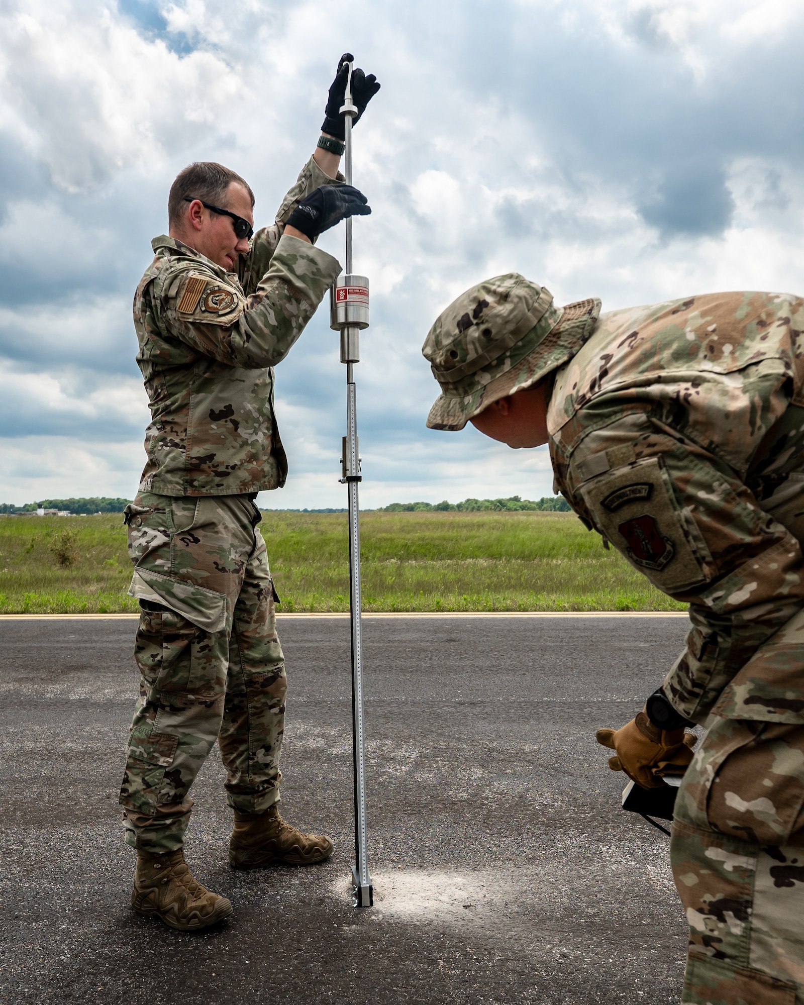 Airmen from the Kentucky Air National Guard’s 123rd Contingency Response Group test the payment density of a taxiway at Barkley Regional Airport in Paducah, Ky., May 14, 2025, to determine if the facilities can support the weight of large cargo aircraft. The test was part of Exercise Grindstone, a major earthquake-response simulation staged May 13-15 in the New Madrid Seismic Zone, the most active seismic area in the Eastern United States. (U.S. Air National Guard photo by Dale Greer)