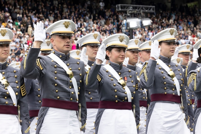 U.S. Military Academy cadets raise their right hands during graduation.