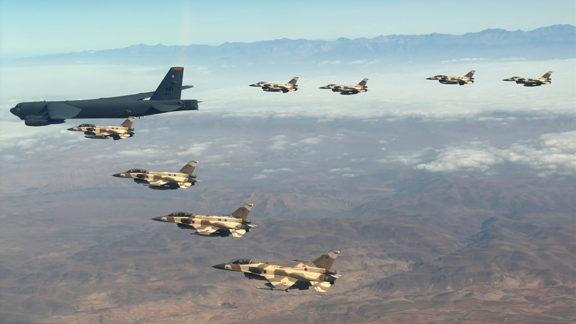 A U.S. Air Force B-52H Stratofortress aircraft assigned to Bomber Task Force Europe integrates with Royal Moroccan Air Force F-16s fighter jets in support of African Lion 2025. AL25, the largest annual military exercise in Africa, demonstrates the reach of U.S. airpower and the U.S. Air Force’s enduring commitment to collaboration with partner forces.