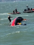 SAN FRANCISCO – Coast Guard crewmembers rescued eight passengers of a sailing vessel in the San Francisco bay, Saturday afternoon.