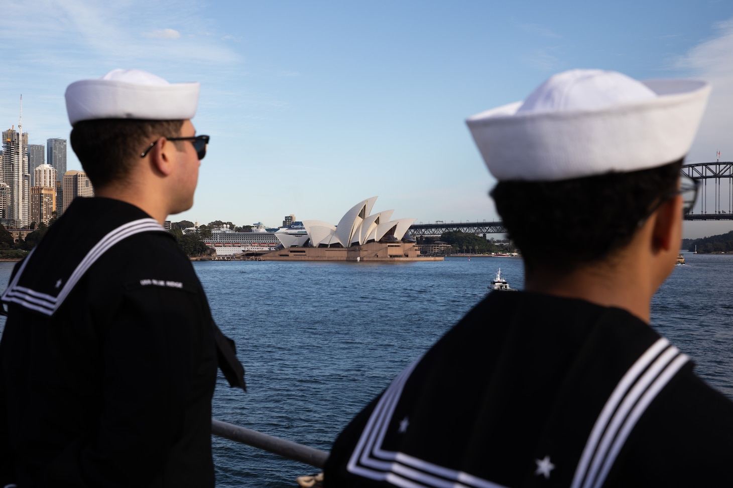 SYDNEY, Australia (May 26, 2025) – Sailors assigned to the U.S. 7th Fleet flagship USS Blue Ridge (LCC 19) and 7th Fleet Staff man the rails while pulling into Sydney, Australia for a scheduled port visit, May 26, 2025.  7th Fleet is the U.S. Navy's largest forward-deployed numbered fleet, and routinely interacts and operates with allies and partners in preserving a free and open Indo-Pacific region. (U.S. Navy photo by Lt.j.g. Sarah Merrill)